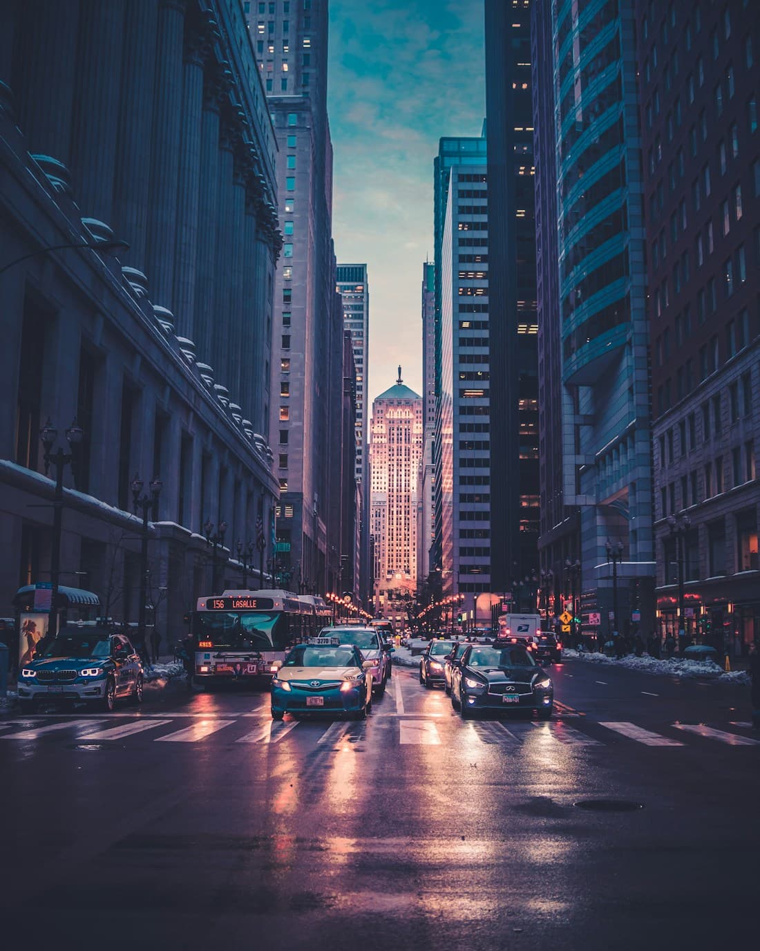 An illuminated city skyline at dusk